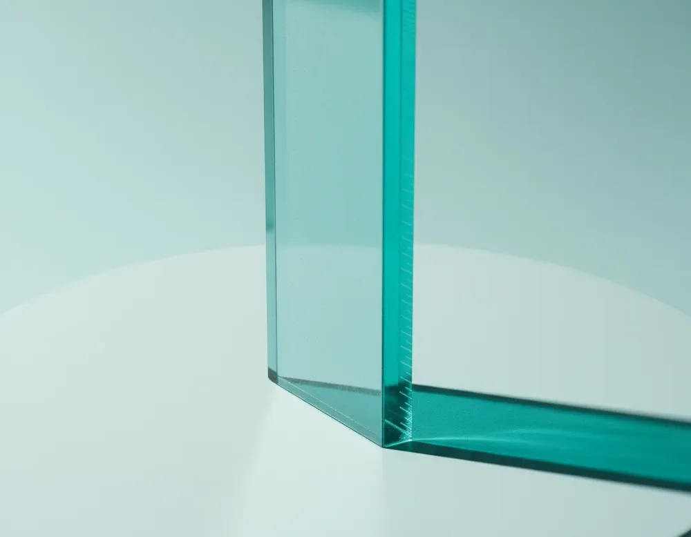 The edge of a teal acrylic ruler in close-up